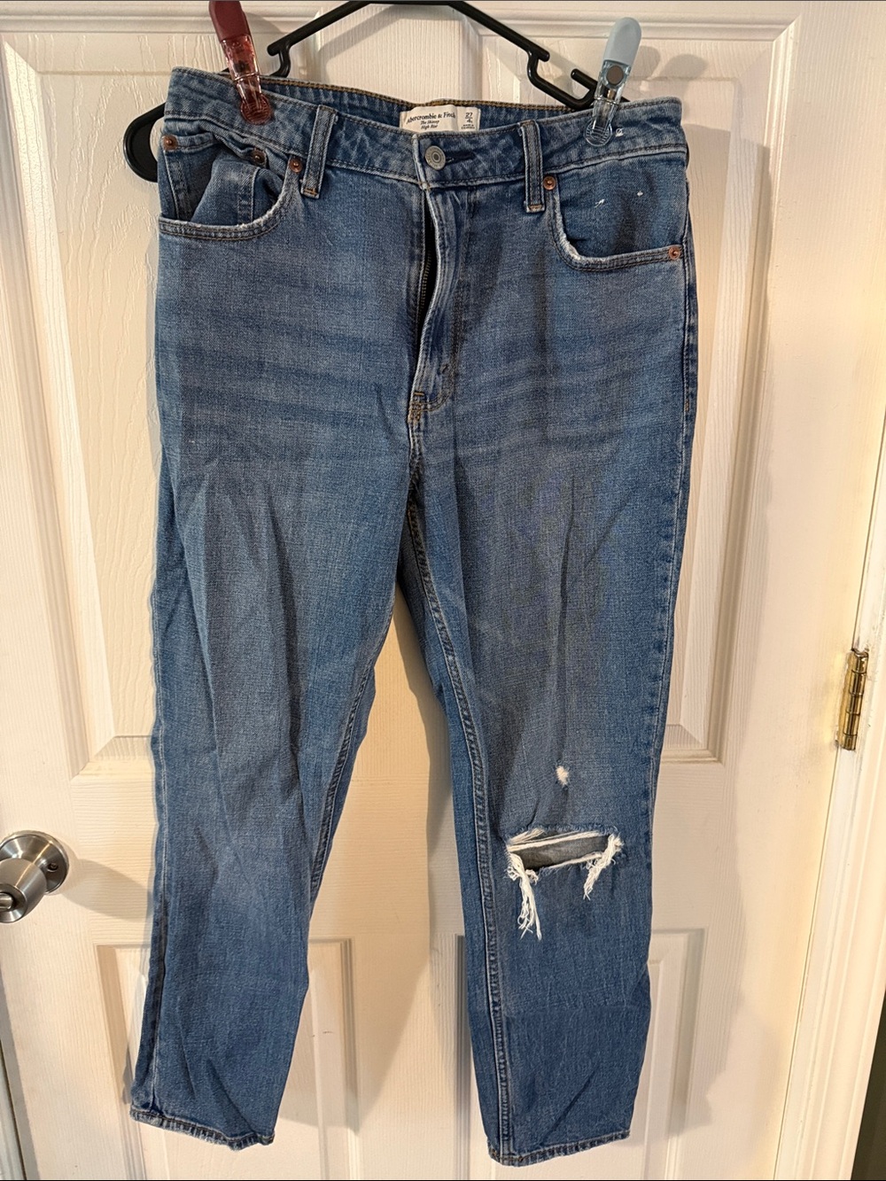Abercrombie and Fitch skinny high-rise curve Love Jean with destroyed knee.